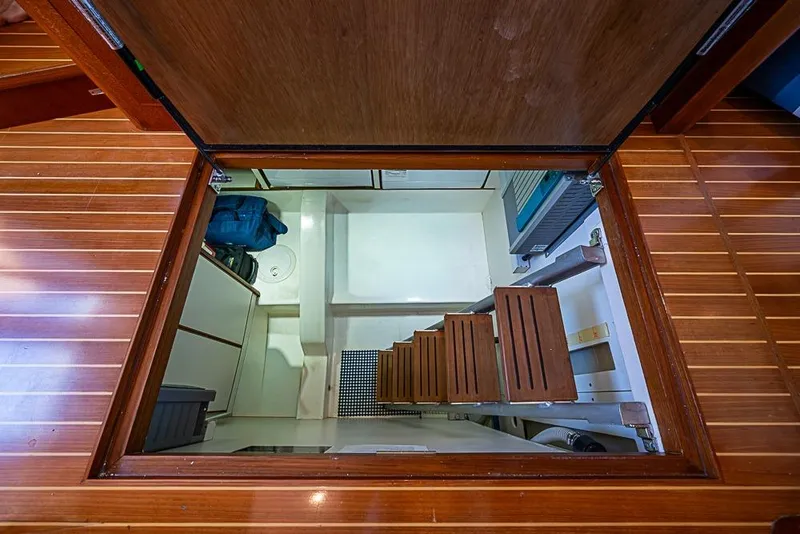 Slide: The Image of Engine room access hatch on 2013 Grand Banks 43 Europa yacht with wooden steps. - 42