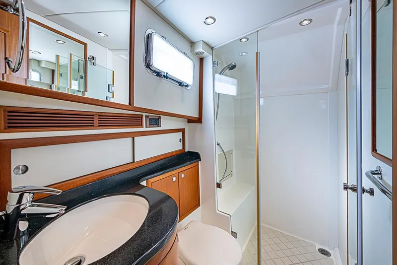 Slide: The Image of Luxurious bathroom in 2013 Grand Banks 43 Europa yacht with modern fixtures and shower. - 50