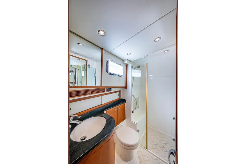 Slide: The Image of Luxurious bathroom in 2013 Grand Banks 43 Europa yacht with modern fixtures and elegant design. - 51