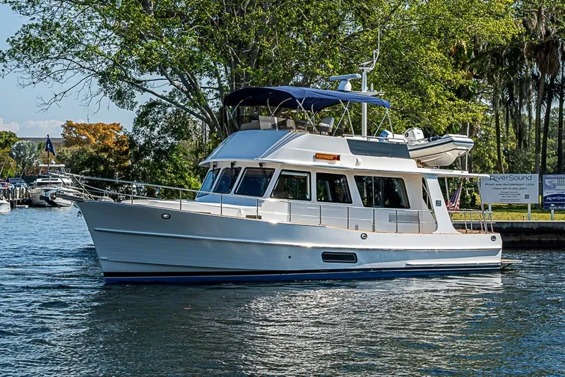 Slide: The Image of 2013 Grand Banks 43 Europa yacht cruising on a scenic river. - 6