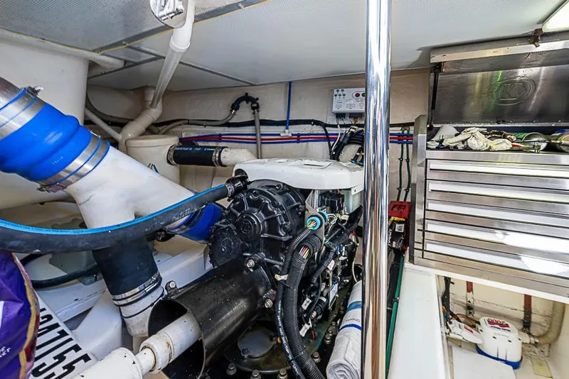 Slide: The Image of Engine room of 2013 Grand Banks 43 Europa, featuring mechanical components and storage drawers. - 61