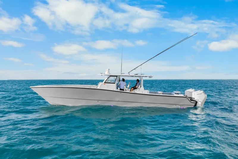 The Image of Freeman 47 boat cruising on open sea under clear blue sky, 2099 model. - 1