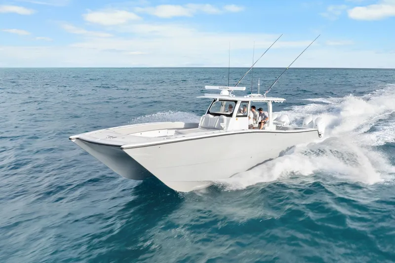 Slide: The Image of Freeman 47 boat cruising on open ocean, 2099 model, clear skies. - 10