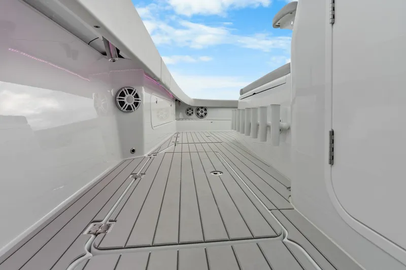 Slide: The Image of Sleek deck of Freeman 47 boat, 2099 model, featuring modern design and speakers. - 19