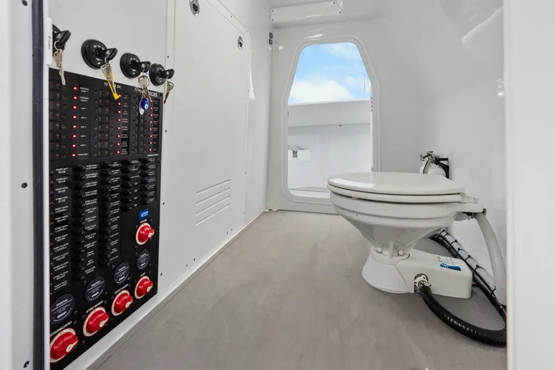 Slide: The Image of Interior of Freeman 47 (2099) boat with control panel and marine toilet. - 23