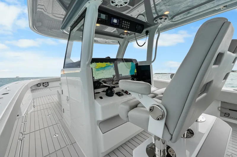 Slide: The Image of Modern Freeman 47 boat cockpit with advanced navigation system, luxurious seating, and ocean view. - 24