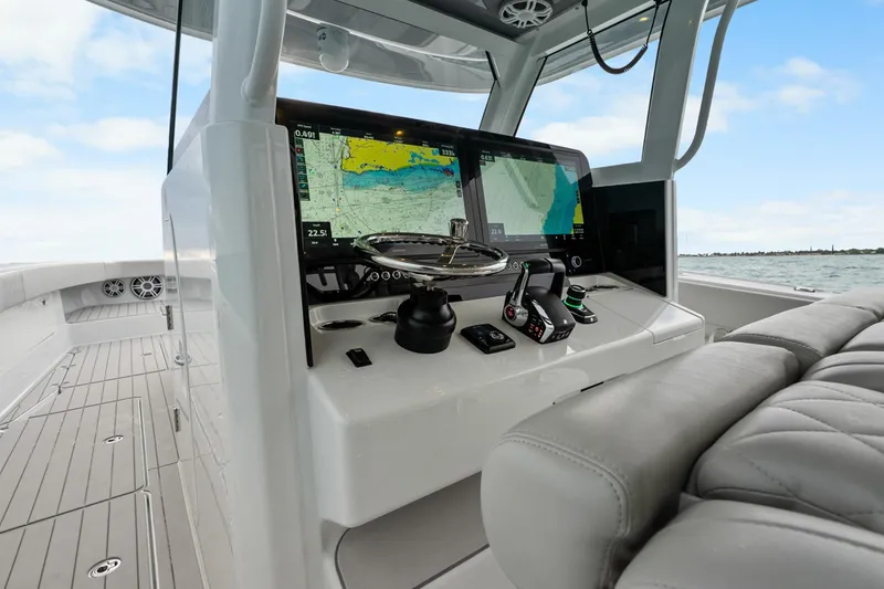 Slide: The Image of Cockpit of Freeman 47 boat, 2099 model, featuring advanced navigation systems and luxurious seating. - 26