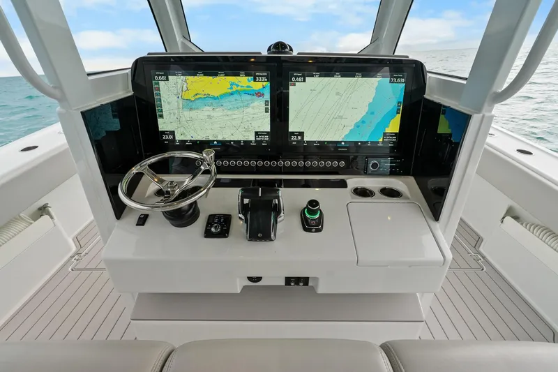 Slide: The Image of Futuristic Freeman 47 boat dashboard with advanced navigation screens, steering wheel, and controls. - 27