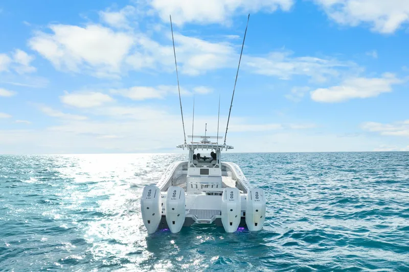 Slide: The Image of Futuristic Freeman 47 boat on open sea, 2099 model, under clear blue sky. - 3