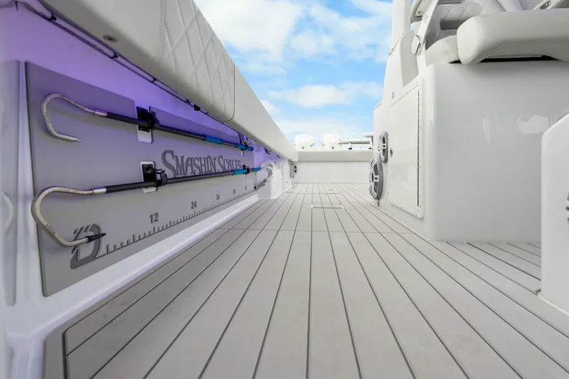 Slide: The Image of Freeman 47 boat interior with fishing gear and sleek design, 2099 model. - 32