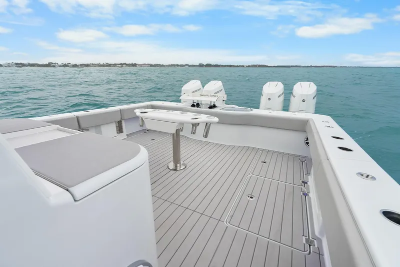 Slide: The Image of Freeman 47 boat deck with seating and engines, 2099 model, on open water. - 35