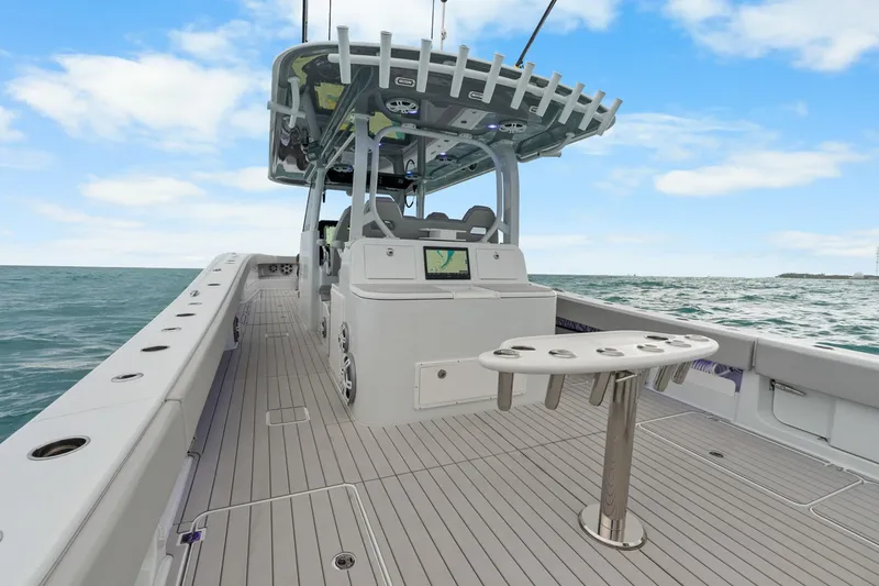 Slide: The Image of Futuristic Freeman 47 boat on ocean, featuring sleek design and advanced navigation system, year 2099. - 37