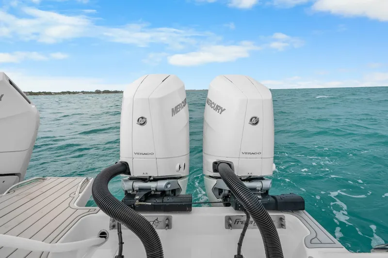 Slide: The Image of Freeman 47 boat with dual Mercury Verado engines on open water, 2099 model. - 46
