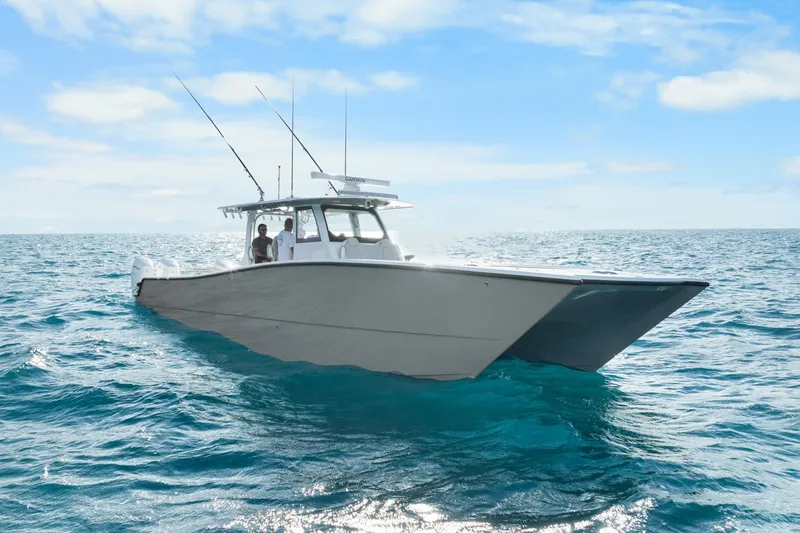 Slide: The Image of Futuristic Freeman 47 boat cruising on open ocean, clear skies above. - 6