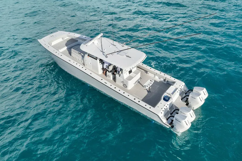 Slide: The Image of Futuristic Freeman 47 boat cruising on clear blue ocean waters, year 2099. - 9