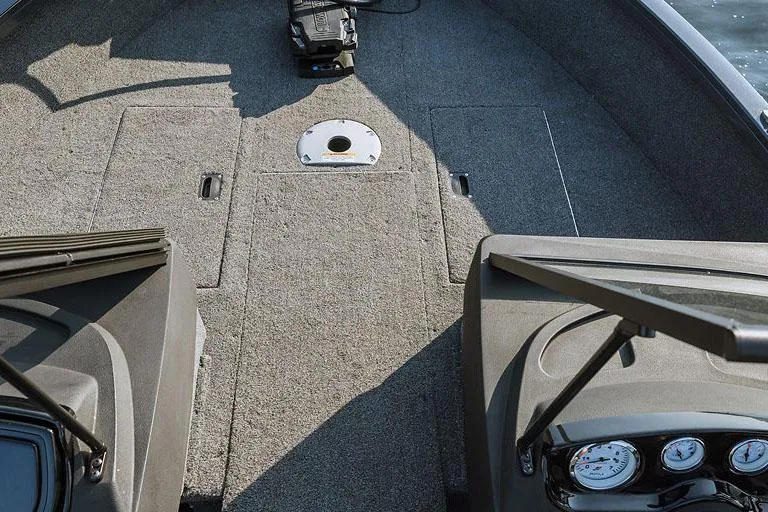 Slide: The Image of Manufacturer Provided Image: 2025 Crestliner 1650 Hawk boat interior with carpeted deck and control panel. - 10