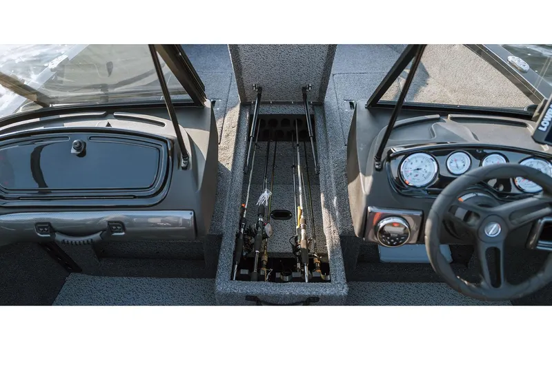 Slide: The Image of Manufacturer Provided Image: 2025 Crestliner 1650 Hawk boat interior with rod storage and dashboard controls. - 14