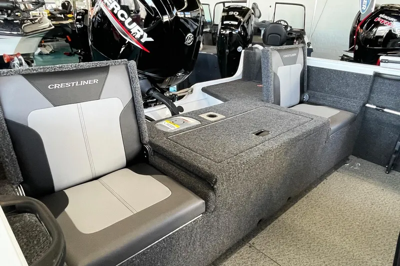 Slide: The Image of 2026 Crestliner 1650 Hawk boat interior with seating and Mercury outboard motor. - 3