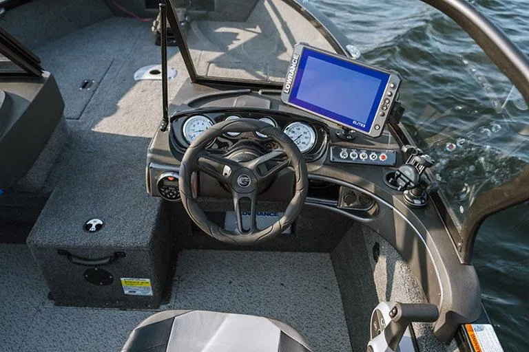 Slide: The Image of Manufacturer Provided Image: 2025 Crestliner 1650 Hawk boat dashboard with steering wheel and navigation system. - 8