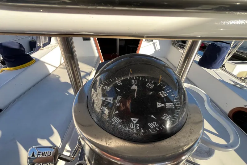Slide: The Image of Compass on 1984 Catalina 36 MkII sailboat, cockpit view with nautical equipment. - 13