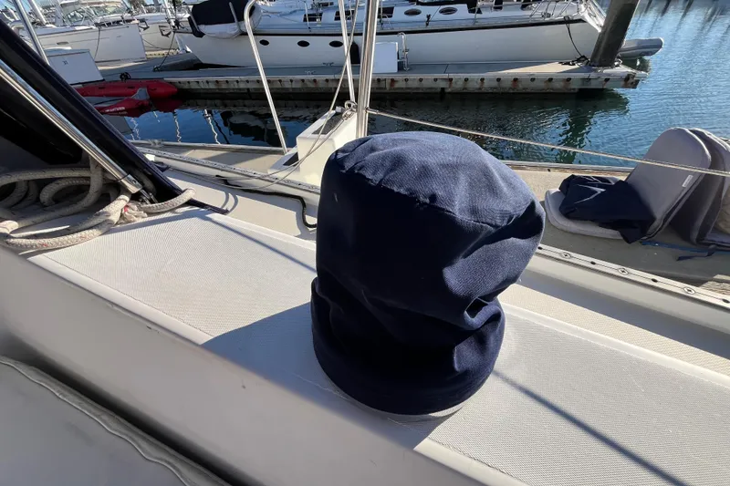 Slide: The Image of 1984 Catalina 36 MkII sailboat deck with navy cover, docked at marina. - 16