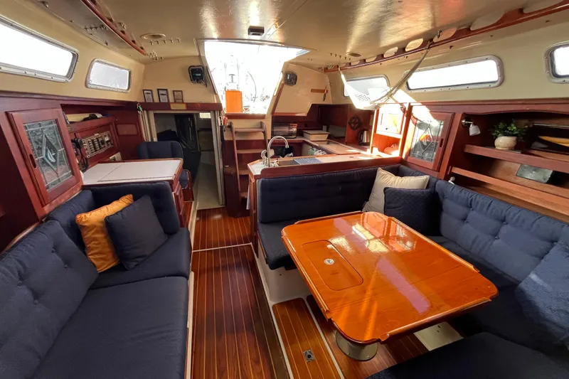 Slide: The Image of Interior of 1984 Catalina 36 MkII sailboat with cozy seating and wooden table. - 20