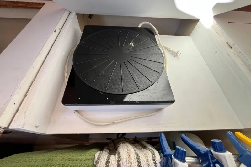 Slide: The Image of Black turntable on a white shelf inside a 1984 Catalina 36 MkII boat. - 28
