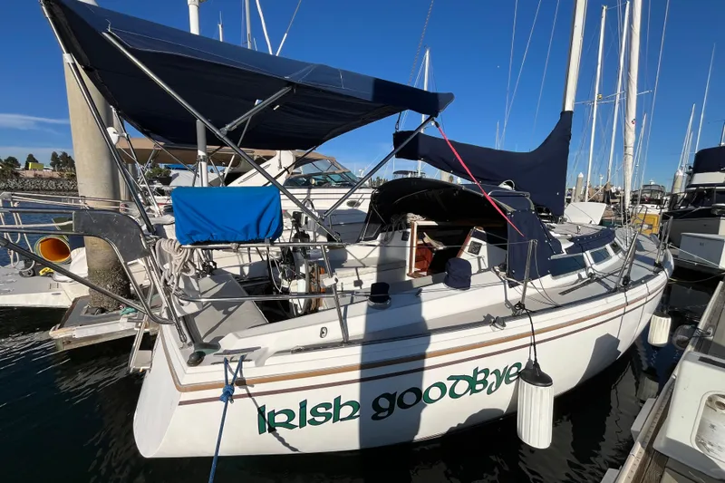 Slide: The Image of 1984 Catalina 36 MkII sailboat named "Irish Goodbye" docked at marina. - 3