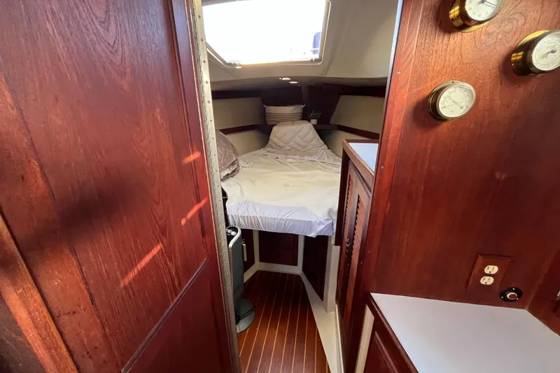 Slide: The Image of Cozy cabin interior of 1984 Catalina 36 MkII sailboat with wooden finish and bed. - 30