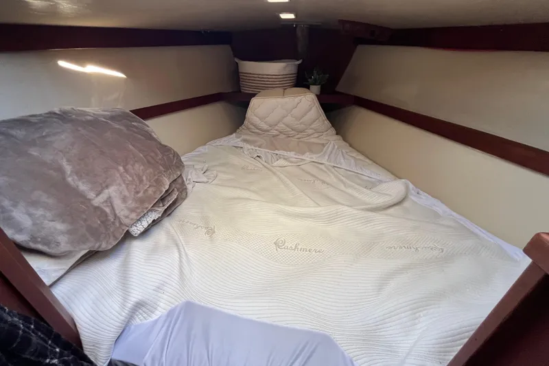 Slide: The Image of Cozy cabin interior of 1984 Catalina 36 MkII sailboat with comfortable bedding. - 31