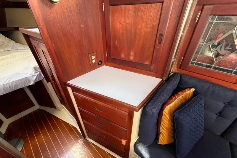 Slide: The Image of Interior of 1984 Catalina 36 MkII sailboat with wood cabinetry and cozy seating. - 32