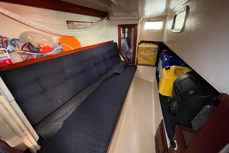 Slide: The Image of Interior of 1984 Catalina 36 MkII sailboat with storage and seating area. - 37