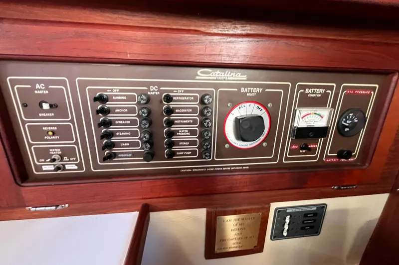 Slide: The Image of Control panel of a 1984 Catalina 36 MkII yacht with AC and DC switches. - 40