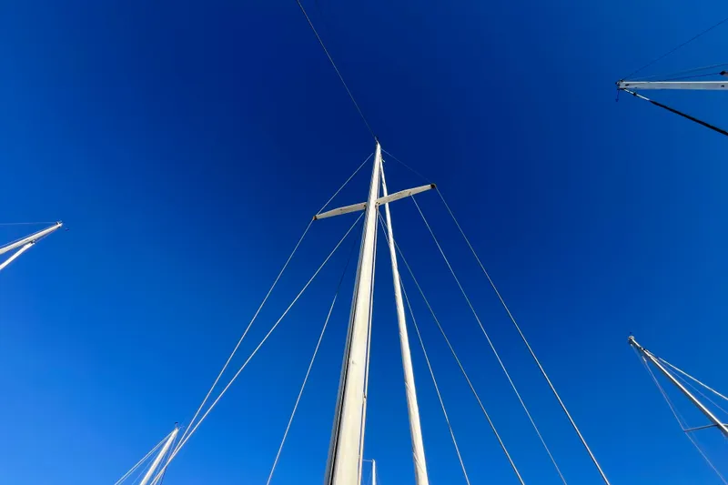 Slide: The Image of Mast of 1984 Catalina 36 MkII sailboat against clear blue sky. - 5