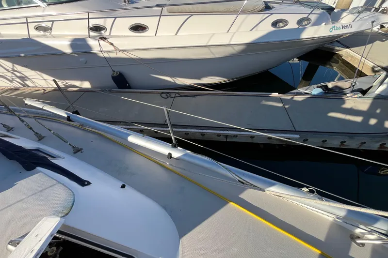 Slide: The Image of Docked Catalina 36 MkII sailboat from 1984 alongside other boats in a marina. - 9