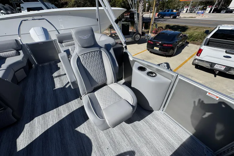Slide: The Image of 2026 Bennington 23 MFB boat interior with gray seating and cup holders. - 29