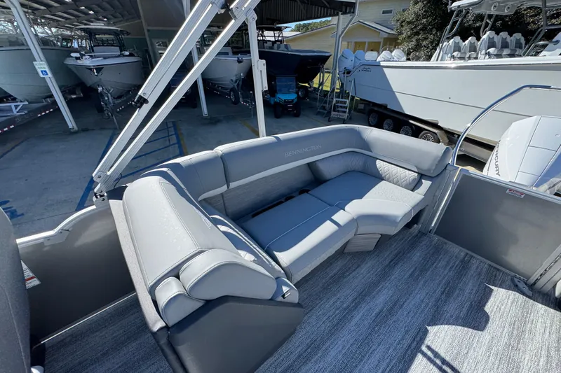 Slide: The Image of 2026 Bennington 23 MFB boat interior with gray seating and modern design. - 31