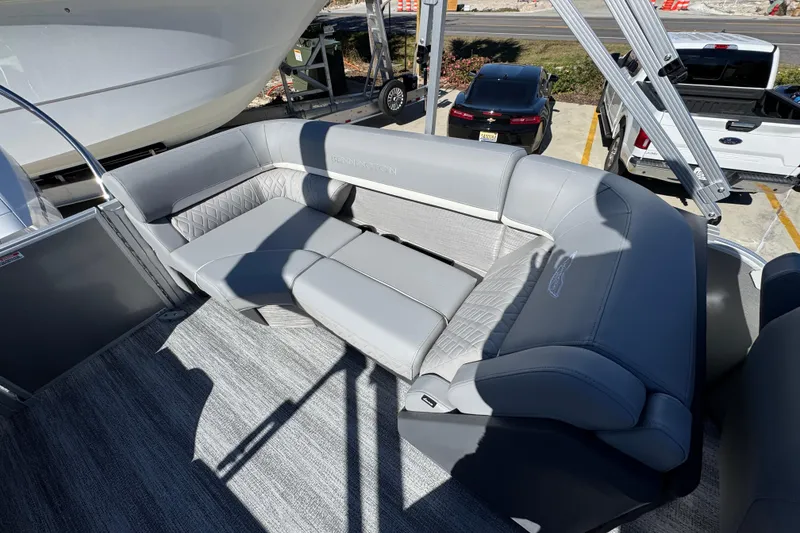 Slide: The Image of 2026 Bennington 23 MFB boat interior with luxurious gray seating and modern design. - 32
