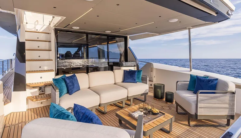 Slide: The Image of Luxurious outdoor seating area on the 2024 Absolute 60 Fly yacht. - 1
