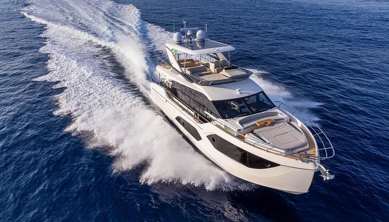 Slide: The Image of 2024 Absolute 60 Fly yacht cruising on open water. - 3