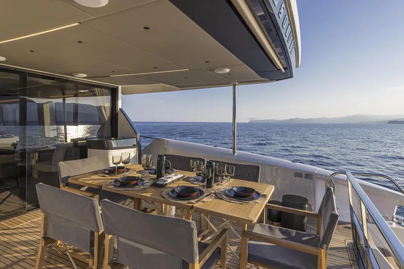 Slide: The Image of Luxury dining area on the 2024 Absolute 60 Fly yacht with ocean view. - 30