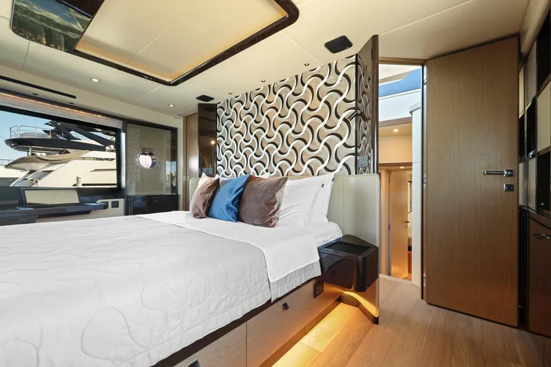Slide: The Image of Luxurious bedroom interior of 2024 Absolute 60 Fly yacht with modern decor and ample natural light. - 39