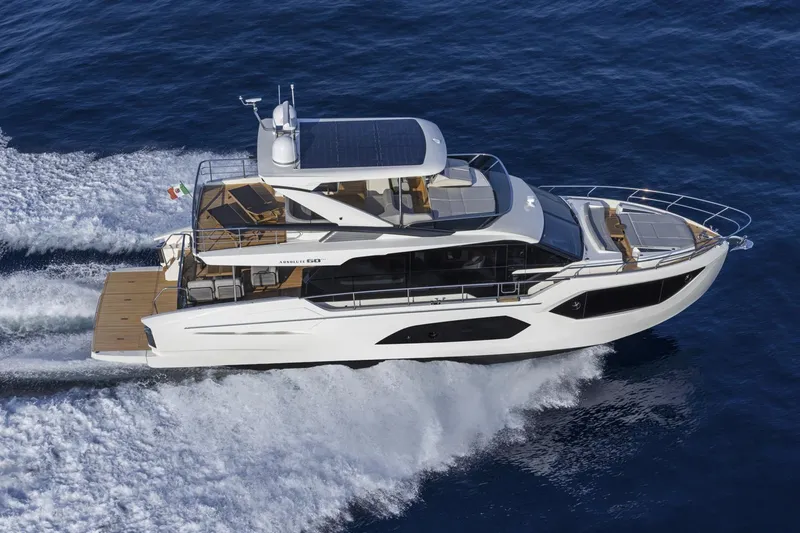 Slide: The Image of 2024 Absolute 60 Fly yacht cruising on open water. - 4