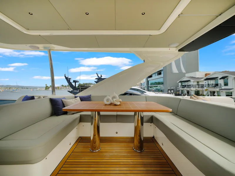 Slide: The Image of Luxurious seating area on the 2024 Absolute 60 Fly yacht with waterfront view. - 20