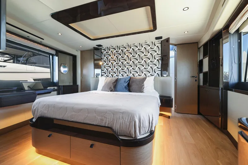 Slide: The Image of Luxurious bedroom interior of the 2024 Absolute 60 Fly yacht with modern decor. - 36