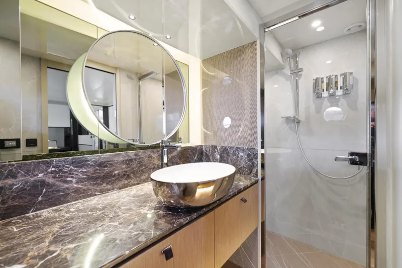 Slide: The Image of Luxurious bathroom in 2024 Absolute 60 Fly yacht with marble countertop and modern shower. - 47