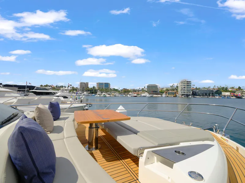 Slide: The Image of Luxurious 2024 Absolute 60 Fly yacht with spacious deck and waterfront view. - 7