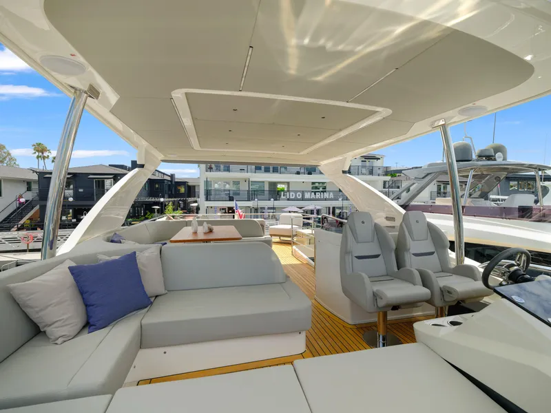 Slide: The Image of Luxurious interior of the 2024 Absolute 60 Fly yacht with modern seating and helm station. - 14