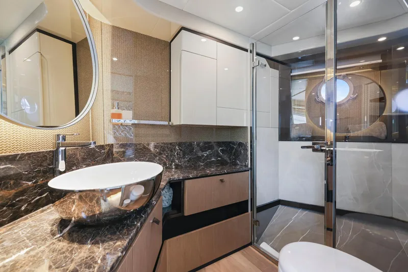 Slide: The Image of Luxurious bathroom in 2024 Absolute 60 Fly yacht with modern fixtures and marble countertop. - 39