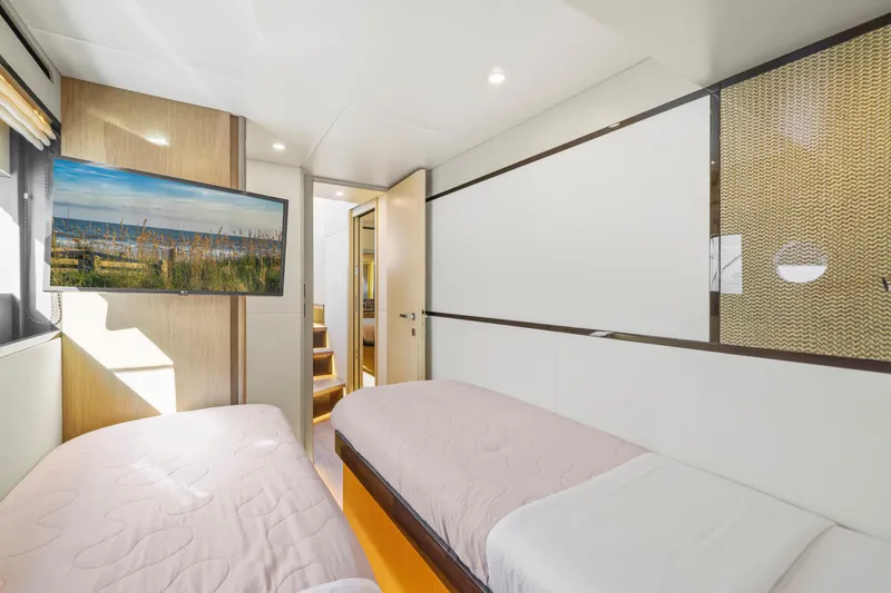 Slide: The Image of Interior of Absolute 60 Fly yacht, 2026, featuring twin beds. - 49